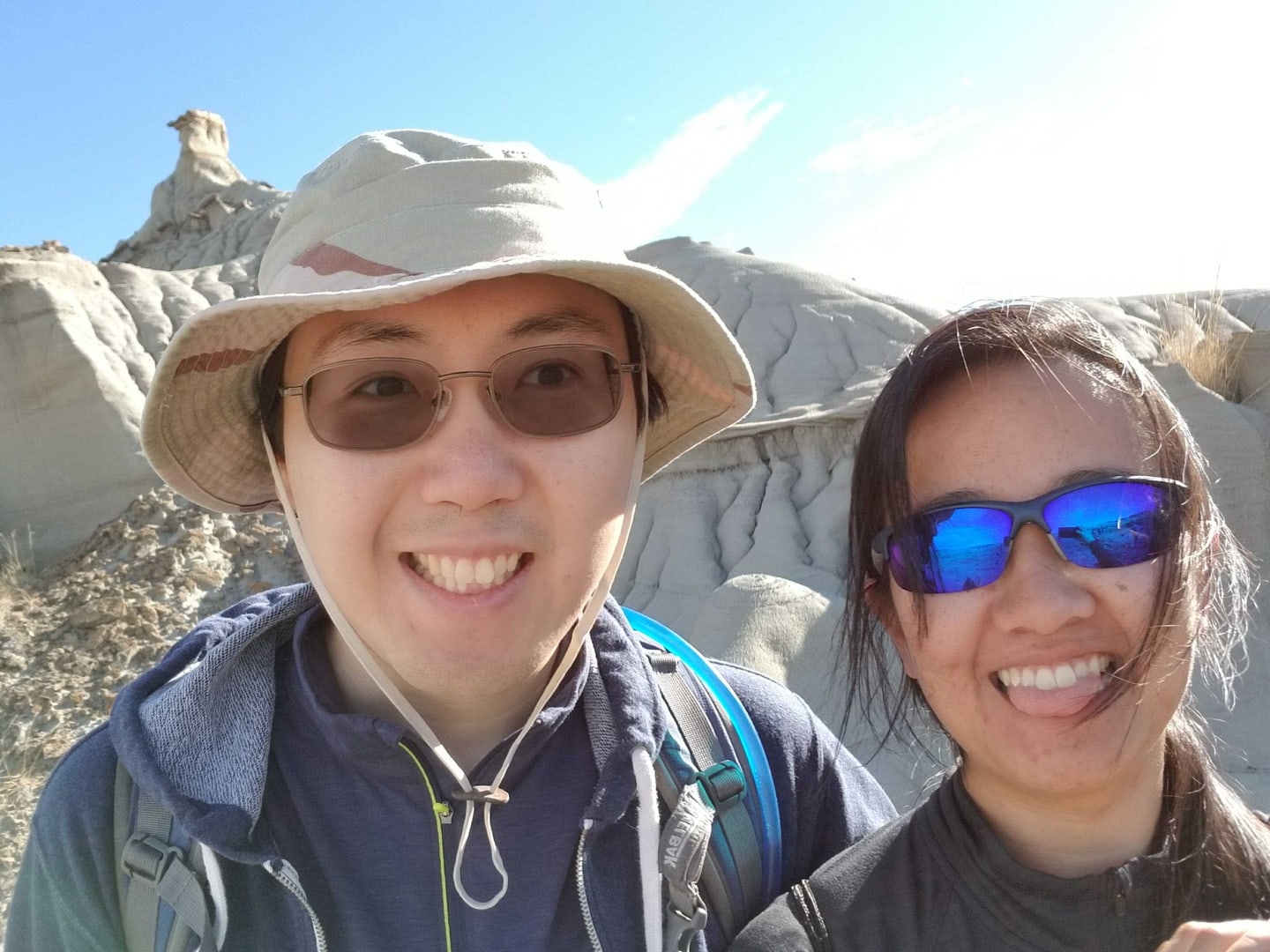 Xiao-yu Fu and a companion smiling on a hike among pale rock formations