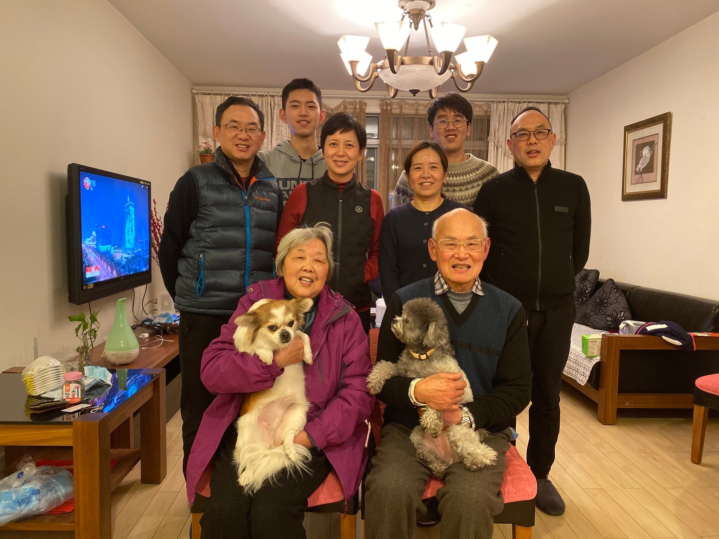 Yang Zhang’s family gathered at home with two dogs