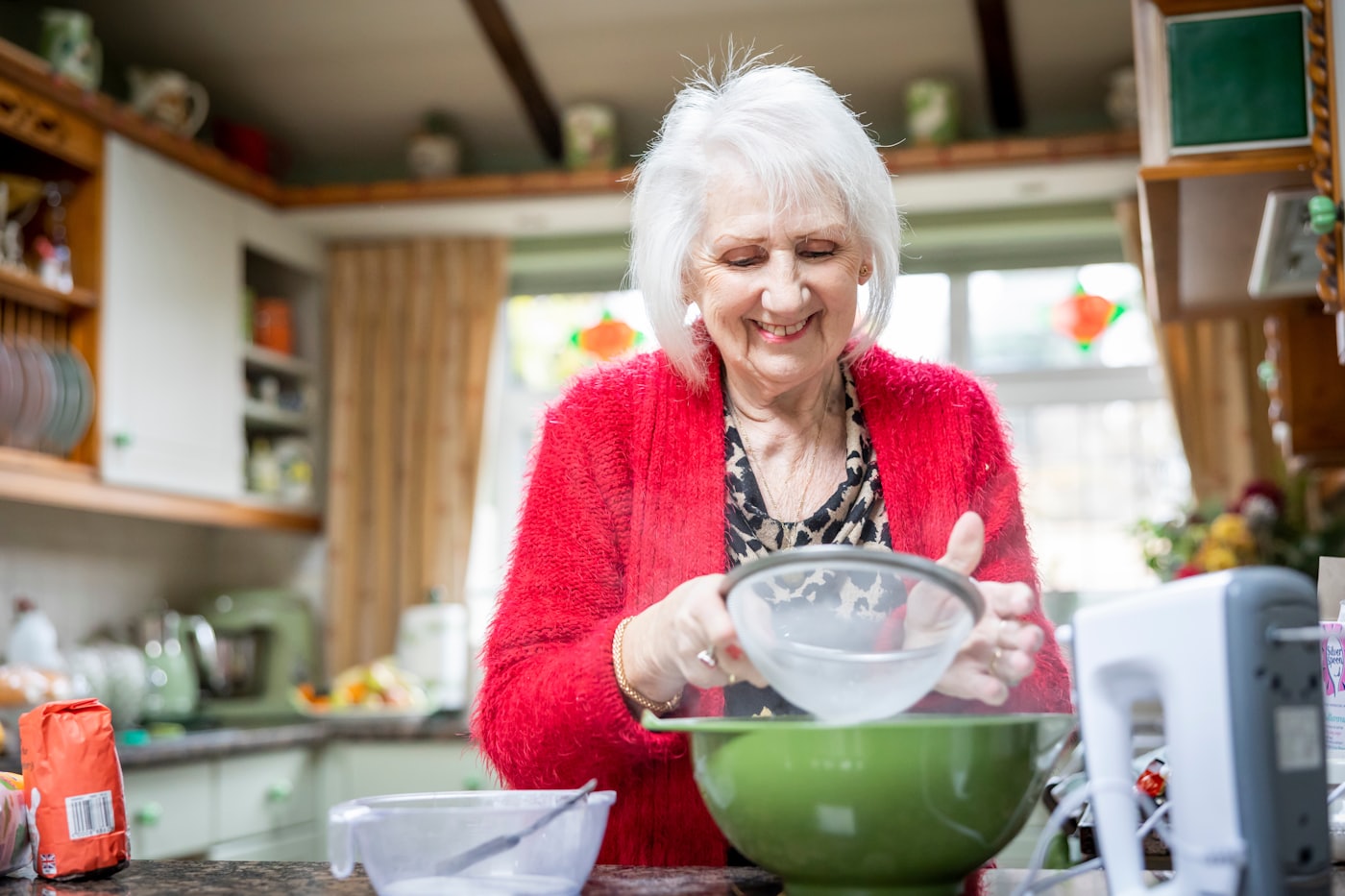 A woman baking in her own kitchen, unhurried