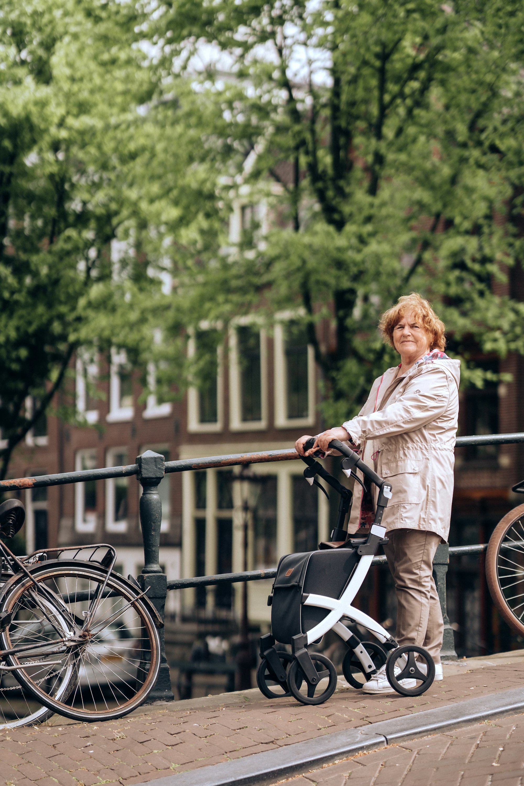 A woman walking through town with her rollator